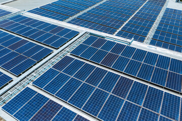 Solar panels background from aerial view on roof of department store.