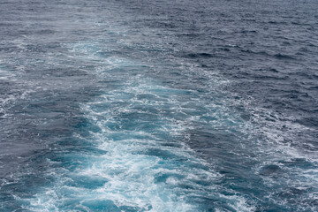 Sea surface. Blue water texture. Close up blue water surface at deep ocean