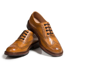Pair of Tanned Brogue Derby Shoes Made of Calf Leather with Rubber Sole Isolated Over Pure White Background.
