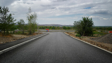 Newly built road. Road under construction. New area in the city. Ust-Kamenogorsk (kazakhstan)