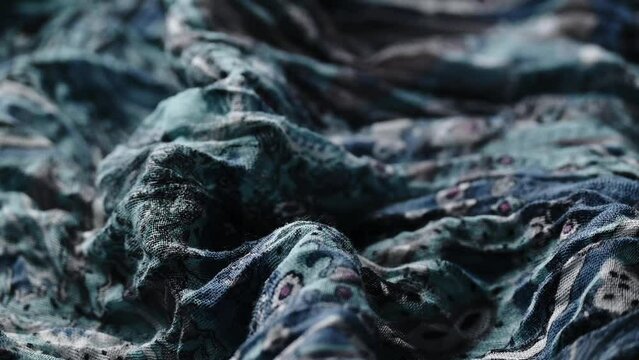 Wrinkled blue textured cloth, fashion industry
