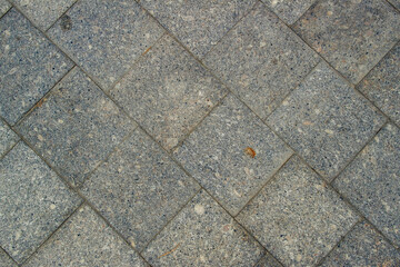 Pavement. Sidewalk tiles background. Pavement tiles. Top view. Closeup. Footpath. Sidewalk