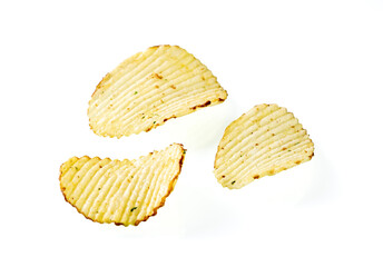 Three plates of potato chips on a white background close-up