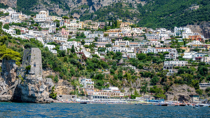 Fototapeta na wymiar Ancient tower and Fornillo beach in Positano seen from the sea. Amalfi Coast, Italy.