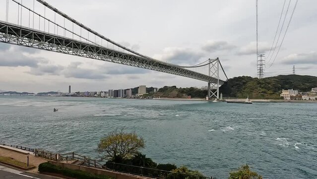 View over Kanmon bridge and the kanmon strait in between the japanese islans Honshu and Kyushu