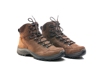 Pair of new brown laced hiking boots isolated on a white background