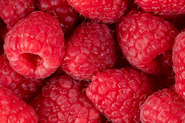 Raspberries. Fresh juicy raspberries bright background. Close-up.