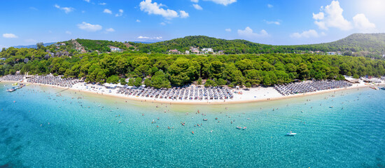 The beautiful Koukounaries beach on the island of Skiathos, Sporades, Greece, with emerald shining sea and fine sand
