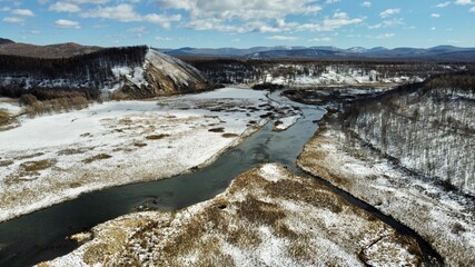 landscape with snow and river