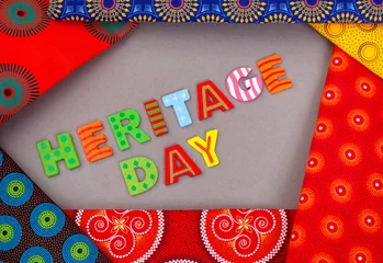 Deurstickers Heritage Day South Africa, 24th September. Heritage Day written in colorful letters with iconic South African printed cloth © Aninka