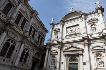 Fototapeta na wymiar Church front, square and traditional venetian appartment buildings - Venice - Italy