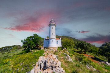 Fototapeta na wymiar Gelidonya lighthouse, just like a hidden paradise located between Adrasan and Kumluca, is one of the locations where green and blue suit each other the most on the Lycian way for hikers and trekkers.