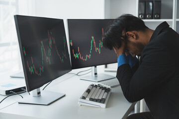 Value stock trading graph with stressed businessman, headache, contemplating in tired office. Sleepy from long hours of work related to Forex Finance, stock market trading.