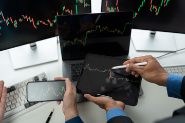 Business team investors discuss stock trading chart growth research report Stock market price using...