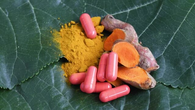 Turmeric (Curcuma longa L.) root and turmeric powder with powder in capsule for alternative medicine ,spa products and food ingredient.