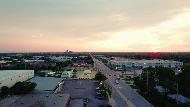 Intersection in Elk Grove Village with BP and Thorntons gas stations. Beautiful Aerial Sunset 2023. Evening with sun setting at the horizon