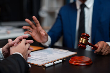 Legal execution department makes an appointment with the customer to sign a mediation agreement to pay the debt. Lawyer discuss the contract document. Treaty of the law. Sign a contract business.
