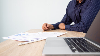 Businessman working at office with digital tablet, laptop computer, smart phone. Professional...