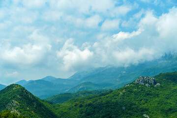 Obraz na płótnie Canvas beautiful mountains, summer landscape, clouds, forest on the hillsides