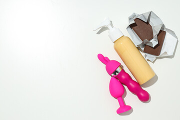 Lubricant with sex toys and chocolate, place for text