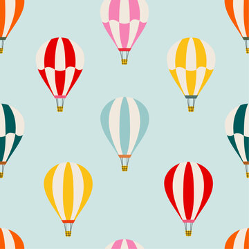 Bright seamless pattern with hot air balloons. Hand drawn balloon in the sky. Cute baby background. Funny decor for nursery, textiles, clothing, packaging, interior.