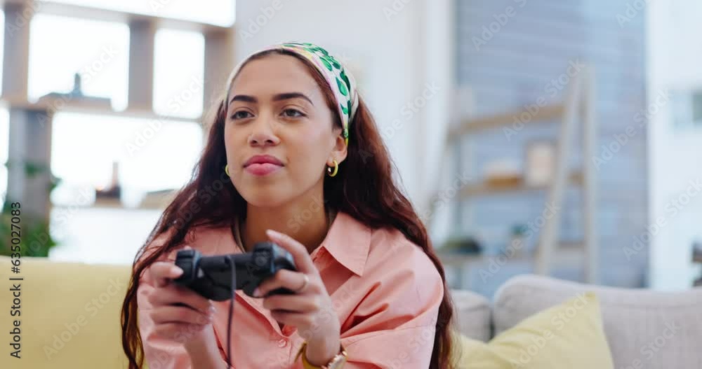 Canvas Prints Woman on sofa playing video games, concentrate and relax in living room of home with internet, controller and streaming. Online gaming, esports and young gamer girl on couch with virtual subscription