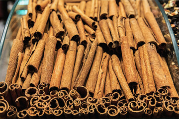 Cinnamon sticks at Egypt bazaar spice store, Istanbul, Turkey. Oriental cooking and seasoning concept. Selected focus, spices background