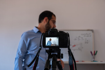Man teaching math online from home
