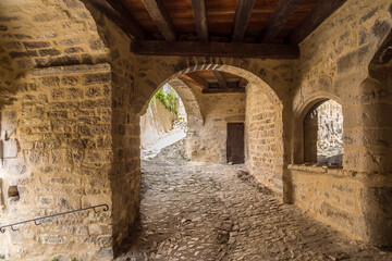 Arched passageway in the medieval village of Dieulefit in Provence