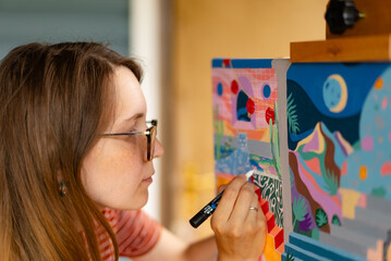 Artist woman with a painting