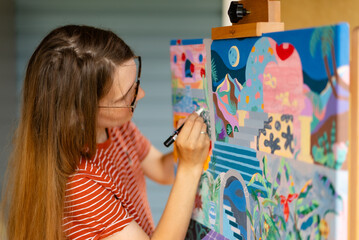Artist woman with a painting