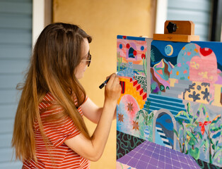 Artist woman with a painting