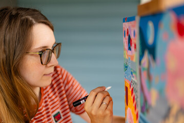 Artist woman with a painting