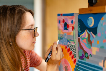 Artist woman with a painting