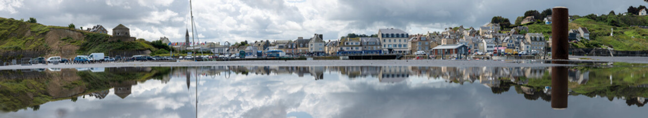 Port-en-Bessin-Huppain, France - 07 24 2023: Panoramic view of the harbor, the pier, boats, the...