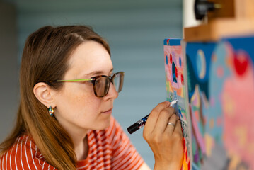 Artist woman with a painting