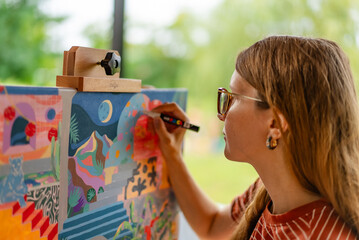 Artist woman with a painting