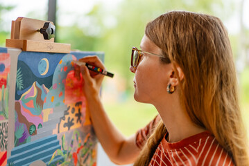 Artist woman with a painting