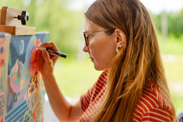 Artist woman with a painting