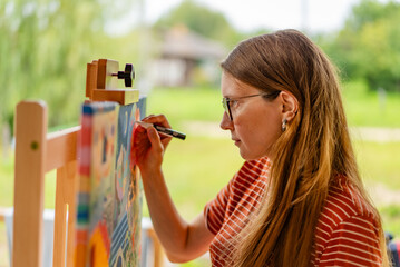 Artist woman with a painting