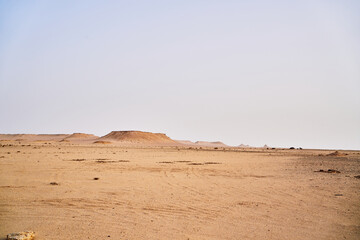 Fototapeta na wymiar A view of some of the desert landscape with rocks formation sand and hills.