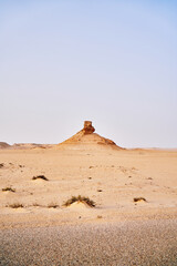 A view of some of the desert landscape with rocks formation sand and hills.