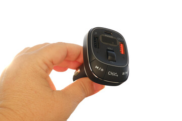 female hands with special device Bluetooth transmitter or Bluetooth receiver, electronic device for...