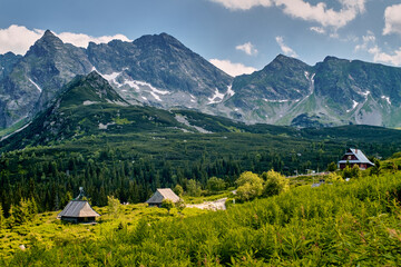 landscape in the mountains, huts and peaks