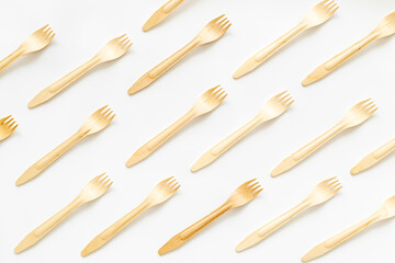 Pattern of wooden eco friendly disposable forks. Zero waste concept