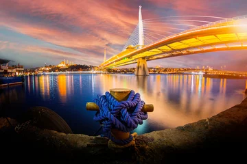 Fototapeten New Halic Metro Bridge at summer night blue sky and city lights in Istanbul, Turkey © Samet