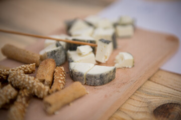 Hard Cheese Festival. Cheese in the market. Homemade cheese. Craft cheese. Milk product. Cheese tasting.