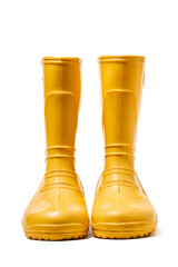 Pair of yellow rubber boots for kids isolated on white background front view.