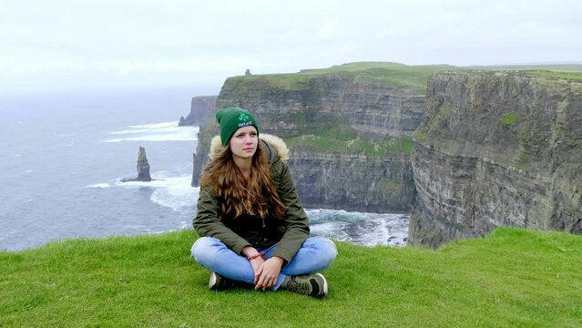Pretty exploring the Cliffs of Moher in Ireland - travel Ireland photography clip 