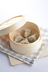 steamed handmade crystal vegetable prawn shrimp dumpling har gao in bamboo basket on white background vegan appetiser dim sum snack Halal food restaurant cuisine menu for cafe